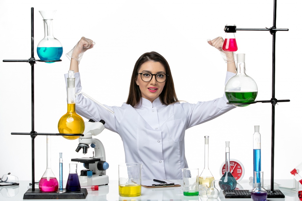 front-view-female-chemist-white-medical-suit-sitting-with-different-solutions-flexing-white-background-science-virus-covid-pandemic-lab.jpg